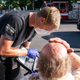 A paramedic treats a man experiencing heat exposure in Salem, Oregon during the Northwest heat wave.